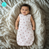 Cozy Baby waring Muslin sleeping bag with red lady bug design