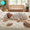 Muslin Hooded towel Bicycle print. A beautiful baby is wrapped in the hooded towel and lying comfortable in the bed