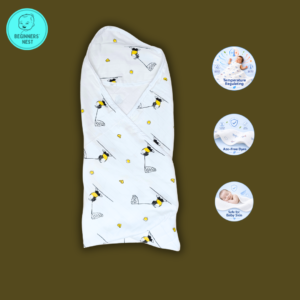 Folded Muslin Hooded Towel with little cute kid playing with a net prints. Soft breathable, safe for baby skin