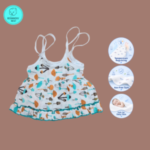 Small Baby girl wearing a muslin frock with small cute cartoonish Mushroom prints on it. Soft and Breathable. Azo-free dye. Gets softer every wash