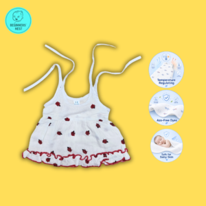 Small Baby girl wearing a muslin frock with Red Lady bug prints on it. Soft and Breathable. Azo-free dye. Gets softer every wash