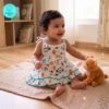 Small Baby girl wearing a muslin frock with small cute cartoonish Mushroom prints on it. Soft and Breathable. Azo-free dye. Gets softer every wash